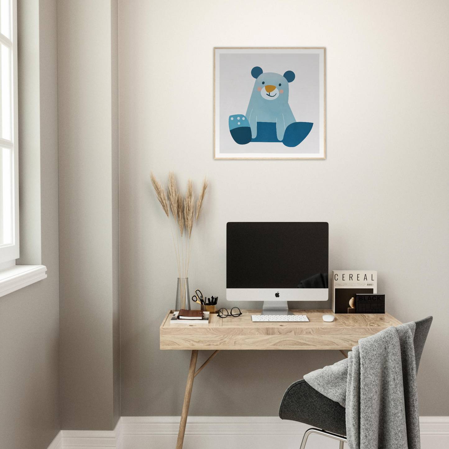 Simple wooden desk with angled legs holding an iMac for stylish nursery decor