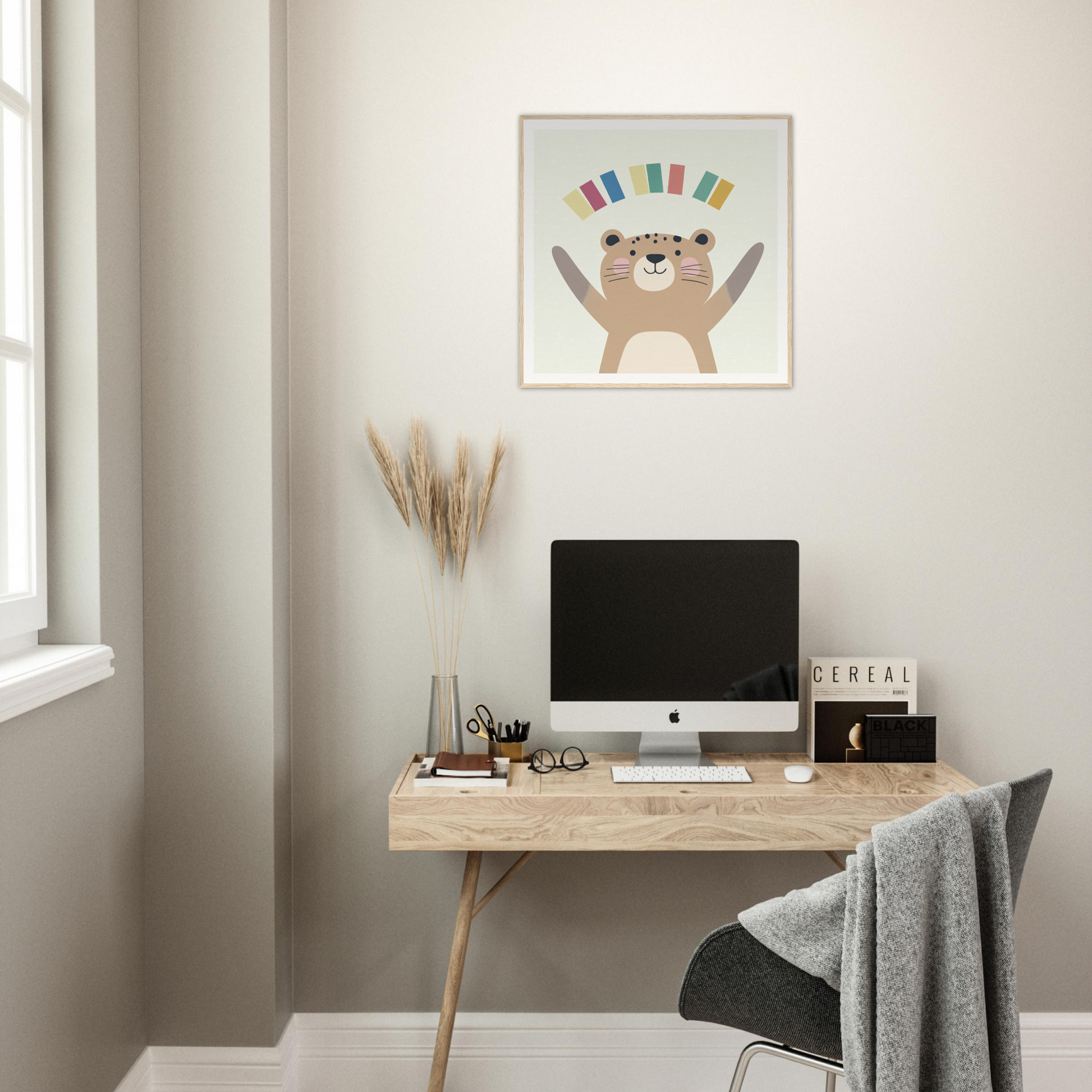 Stylish minimalist wooden desk with iMac and nursery wall art above in Product53