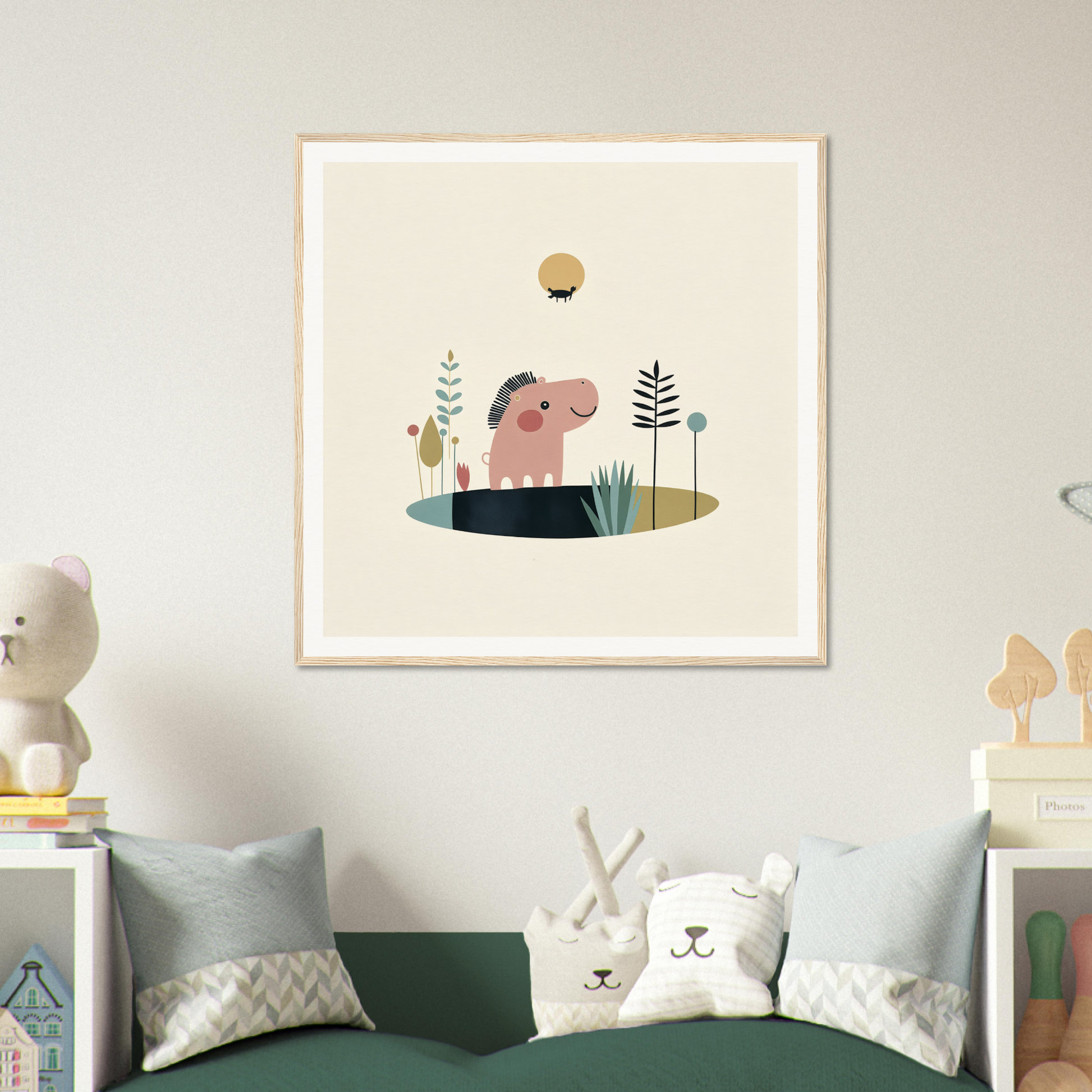 Framed nursery wall art with a cute pink elephant, plants, and sun for adorable nursery decor