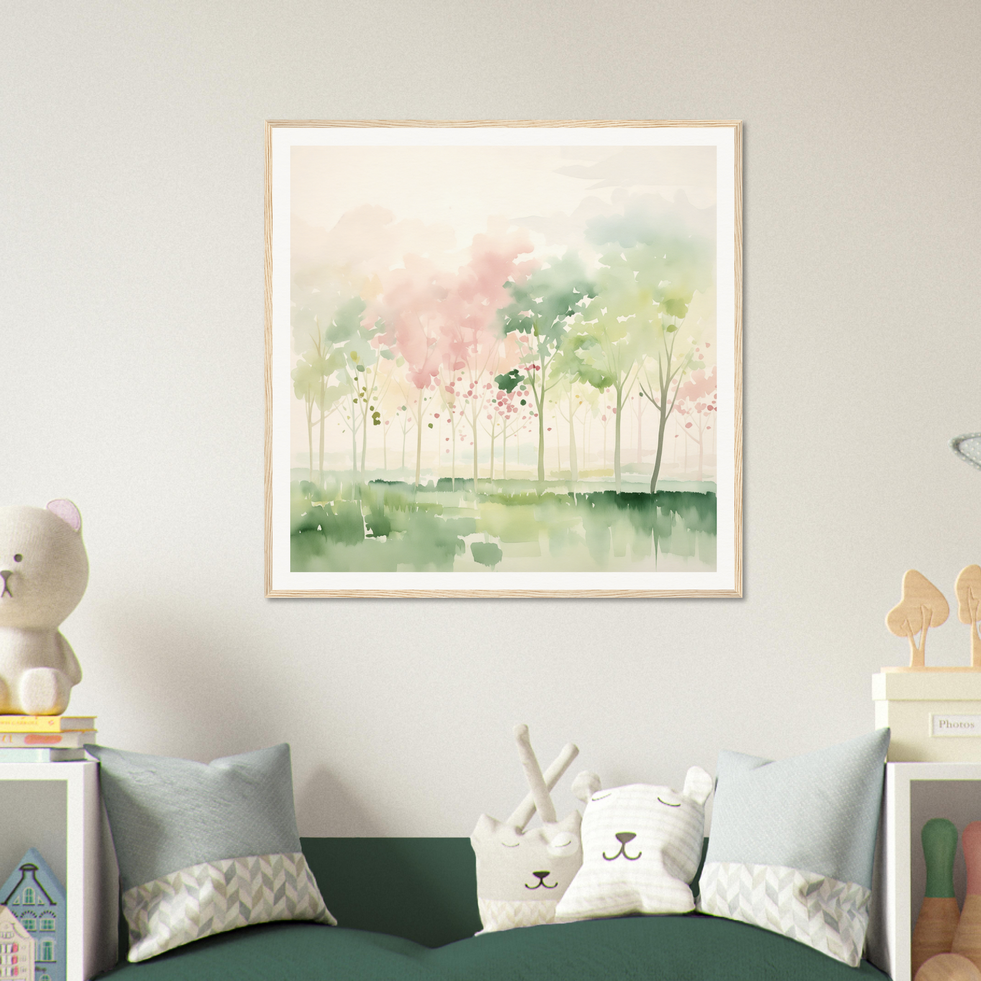 Framed watercolor nursery wall art featuring delicate trees in soft pink and green hues