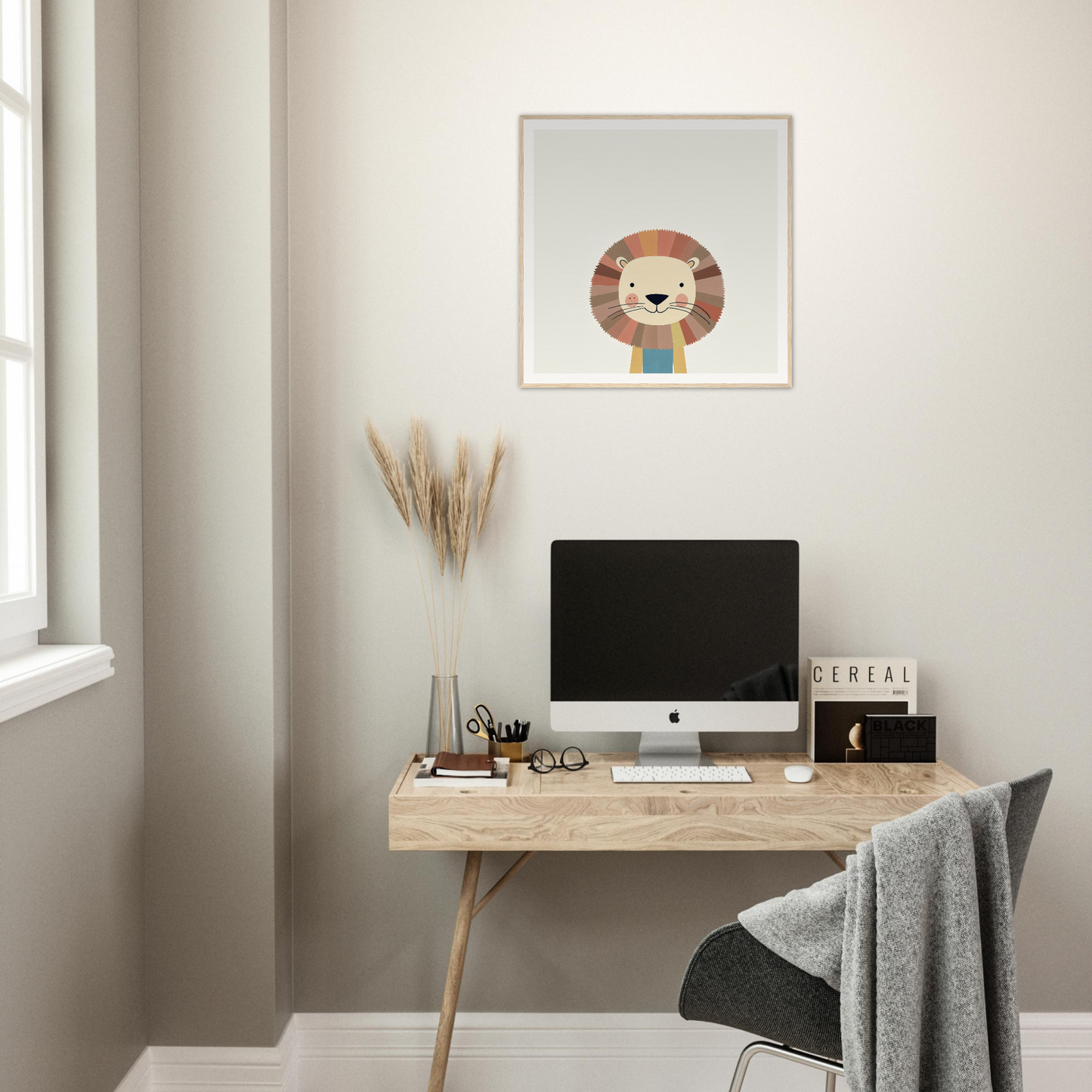 Minimalist wooden desk and iMac, perfect for stylish nursery decor with framed poster