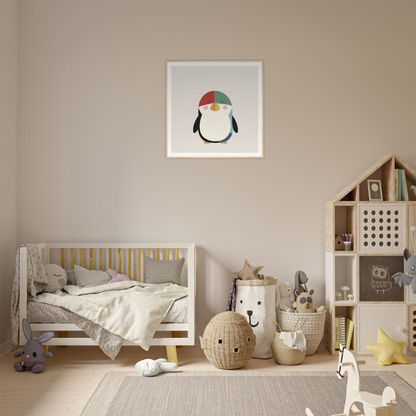 Cozy nursery with neutral tones and cute penguin nursery wall art above crib