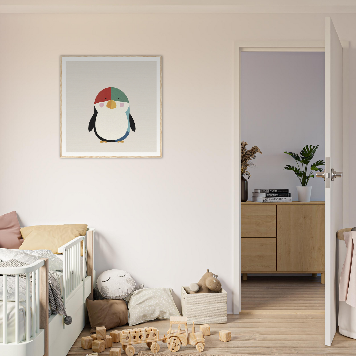 Framed illustration of a penguin with a colorful hat for fun nursery decor