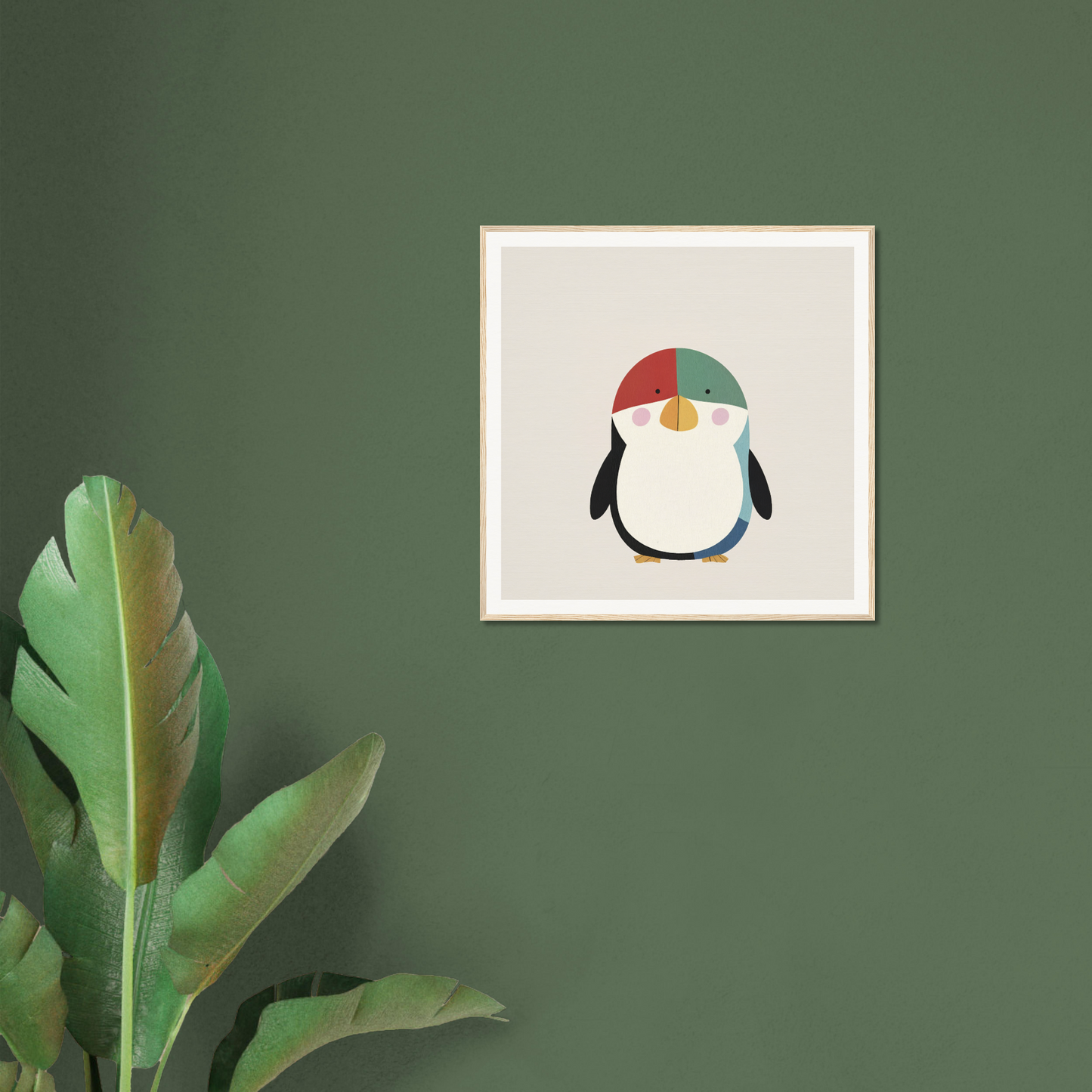 Framed poster of a penguin in a colorful winter hat for cute nursery decor