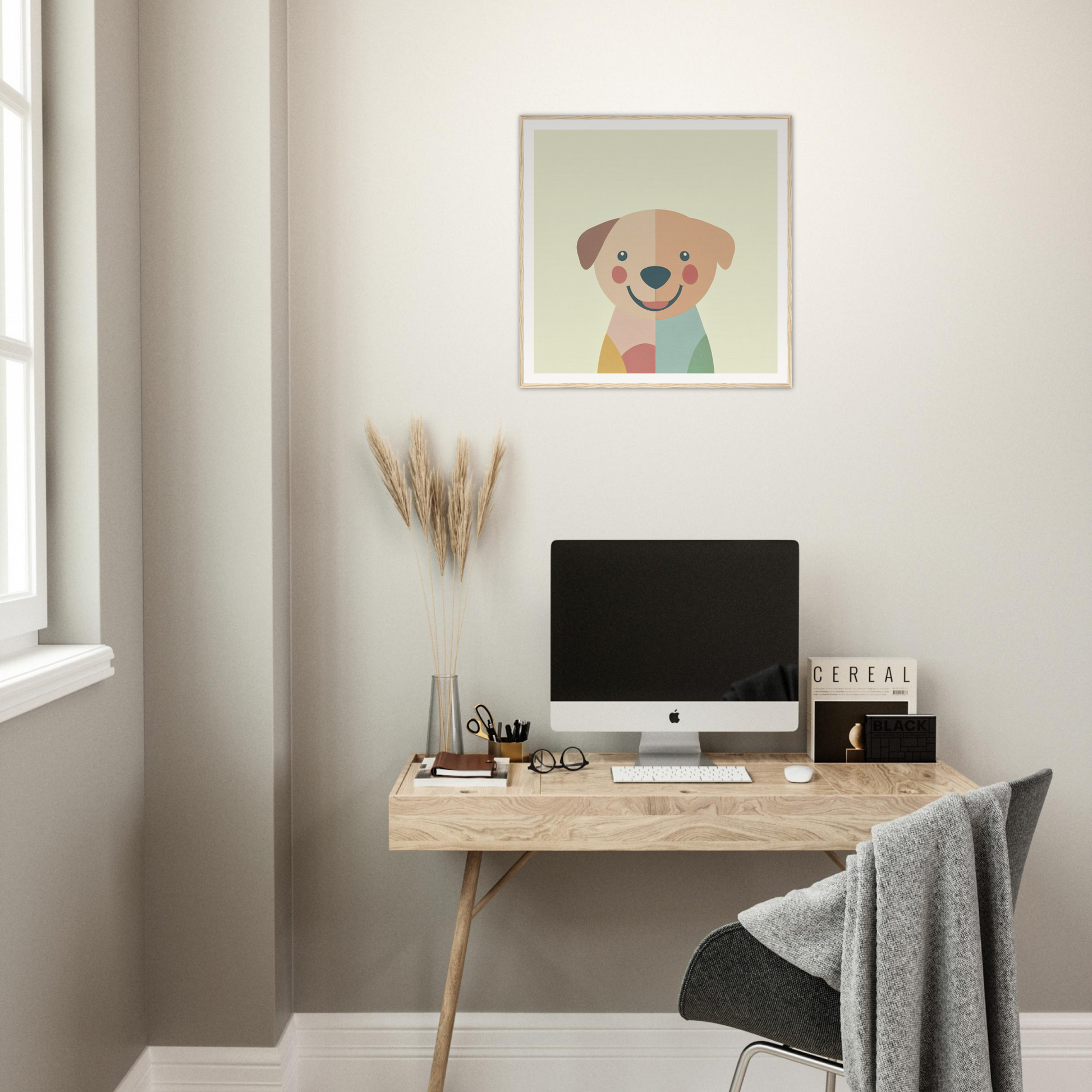 Minimalist wooden desk with iMac and colorful nursery wall art above it