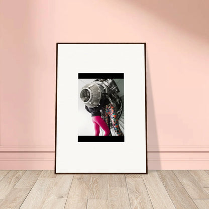 Framed black-and-white wall art of a person in floral jacket and pink pants for room decor