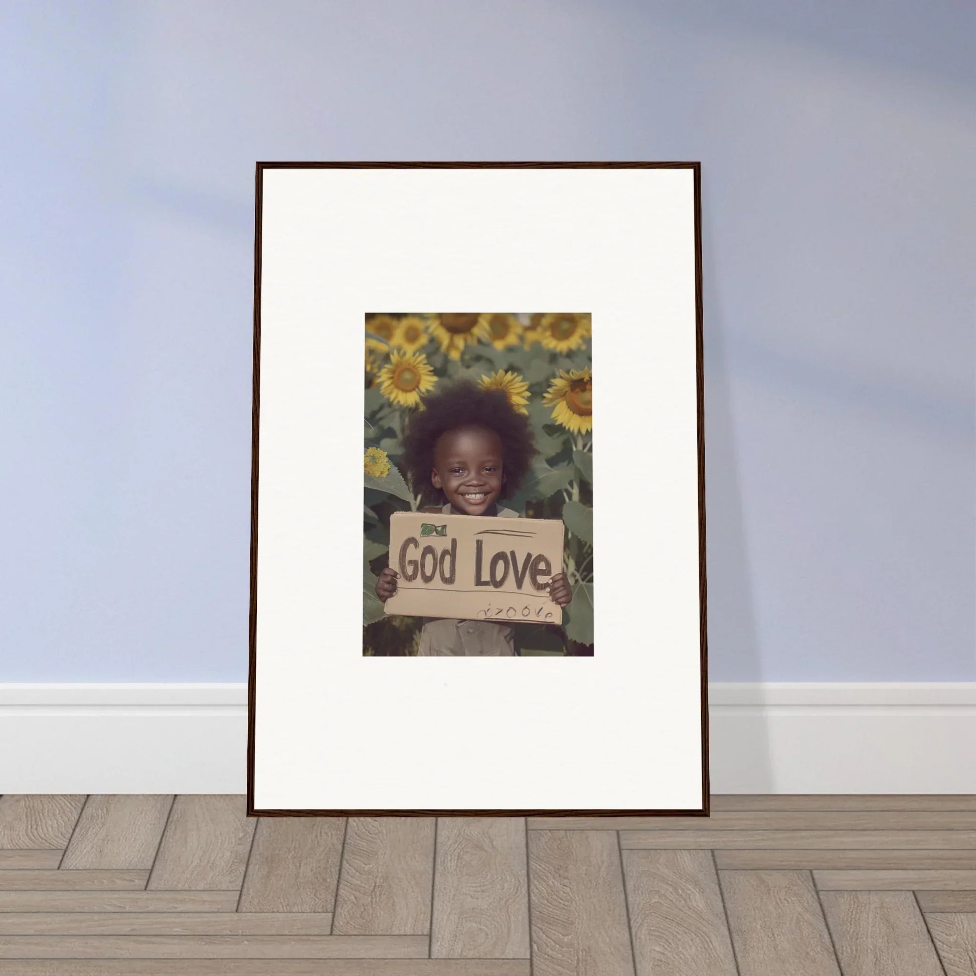 Framed wall art of a child with God Love sign surrounded by sunflowers for daisetism unfolding