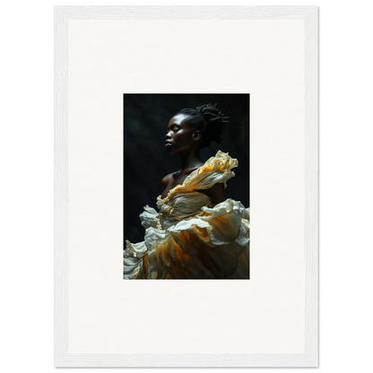 Portrait of a person with dark skin wearing a flowing yellow and white garment.