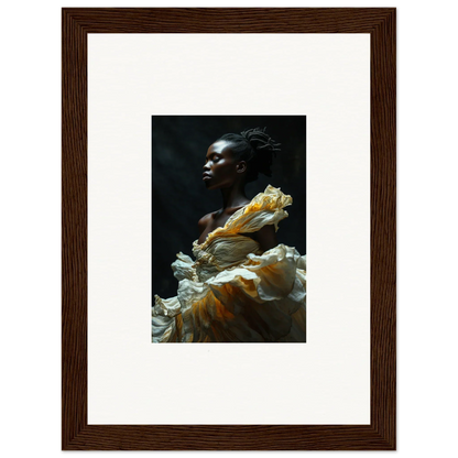 Portrait of a person with dark skin wearing a flowing yellow and white garment against a dark background.