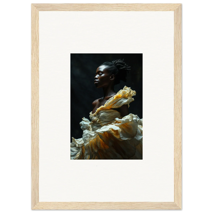 Portrait of a person with dark skin wearing a flowing yellow and white garment against a dark background.