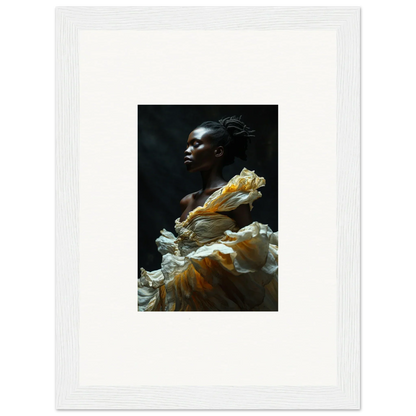 Portrait of a person with dark skin wearing a flowing yellow and white garment.