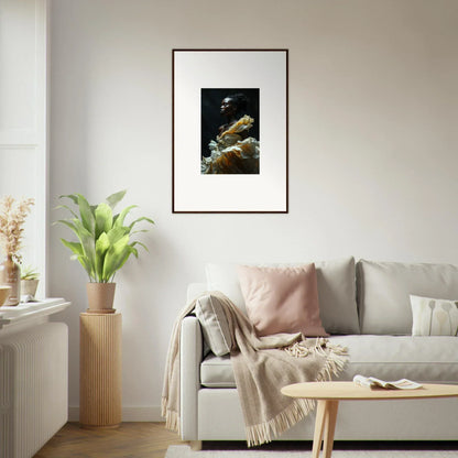 Framed photograph of underwater coral and fish against a dark background.