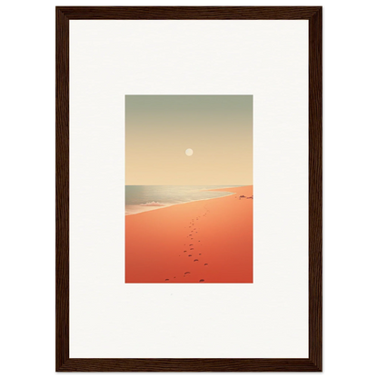 Framed wall art of serene beach scene with footprints on red horizons sand