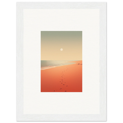 Framed wall art of red horizons at sunset on a beach with footprints in orange sand