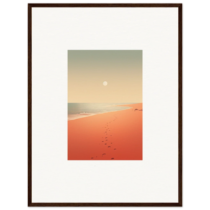 Framed wall art of a sunset beach with footprints on red horizons sand for room decor