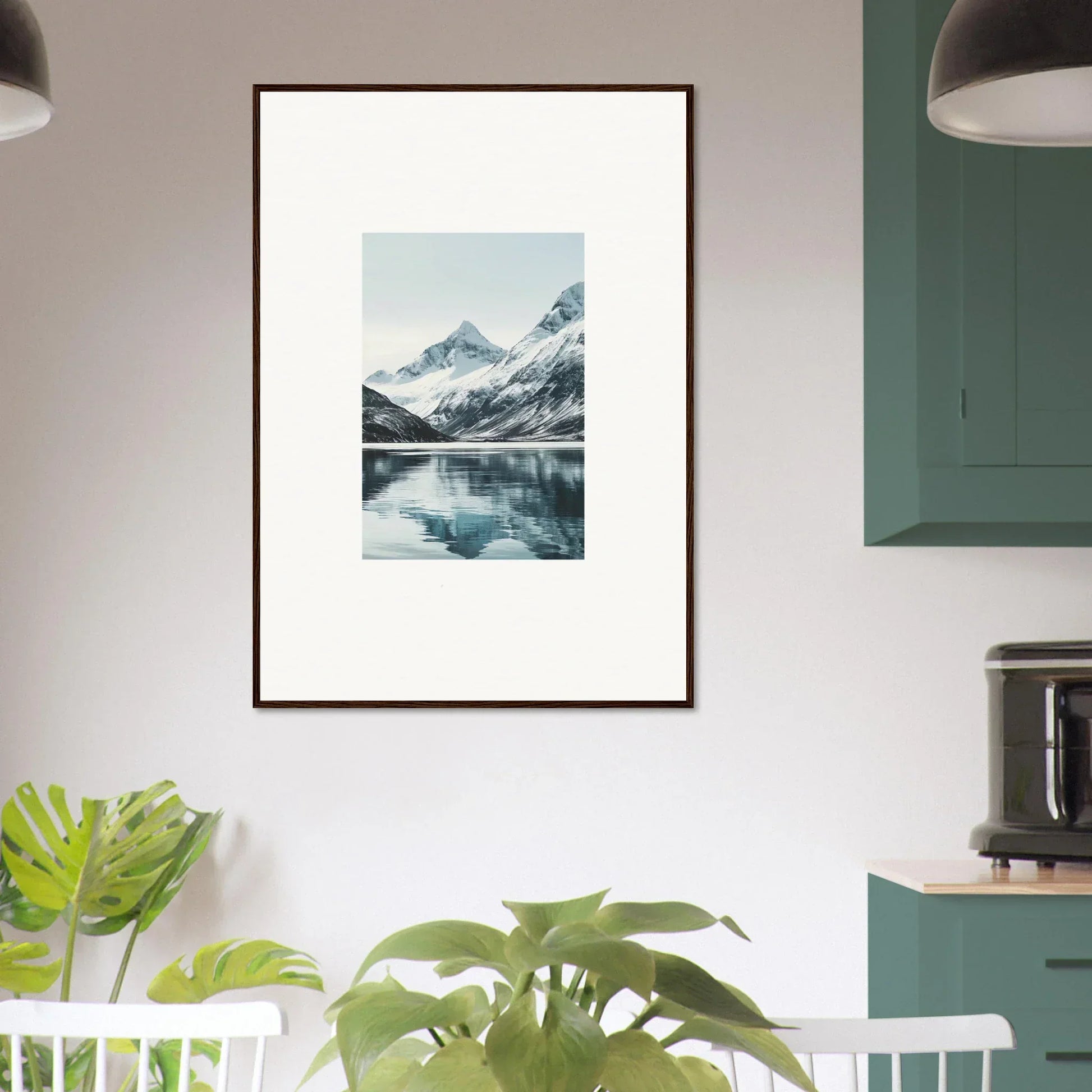 Framed photograph of snow-capped mountains reflecting in a lake for room decoration