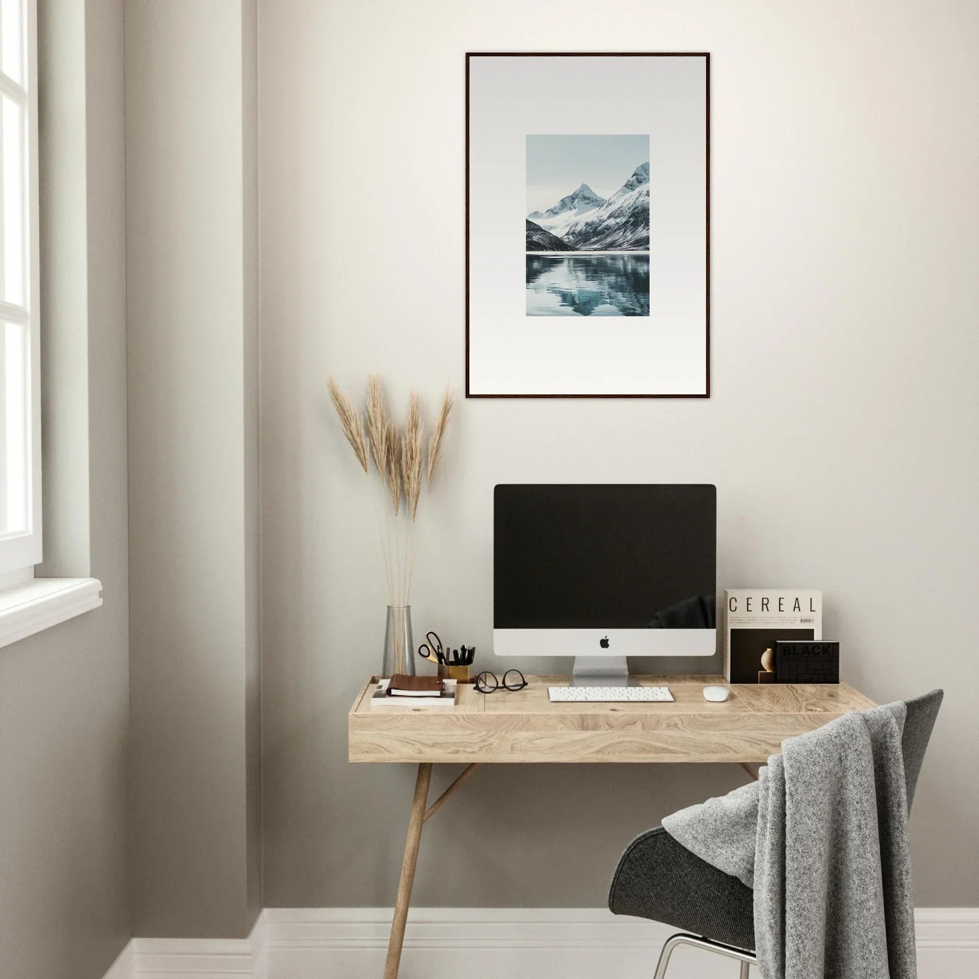 Minimalist wooden desk with computer and canvas print of Alpine Echoes for room decoration