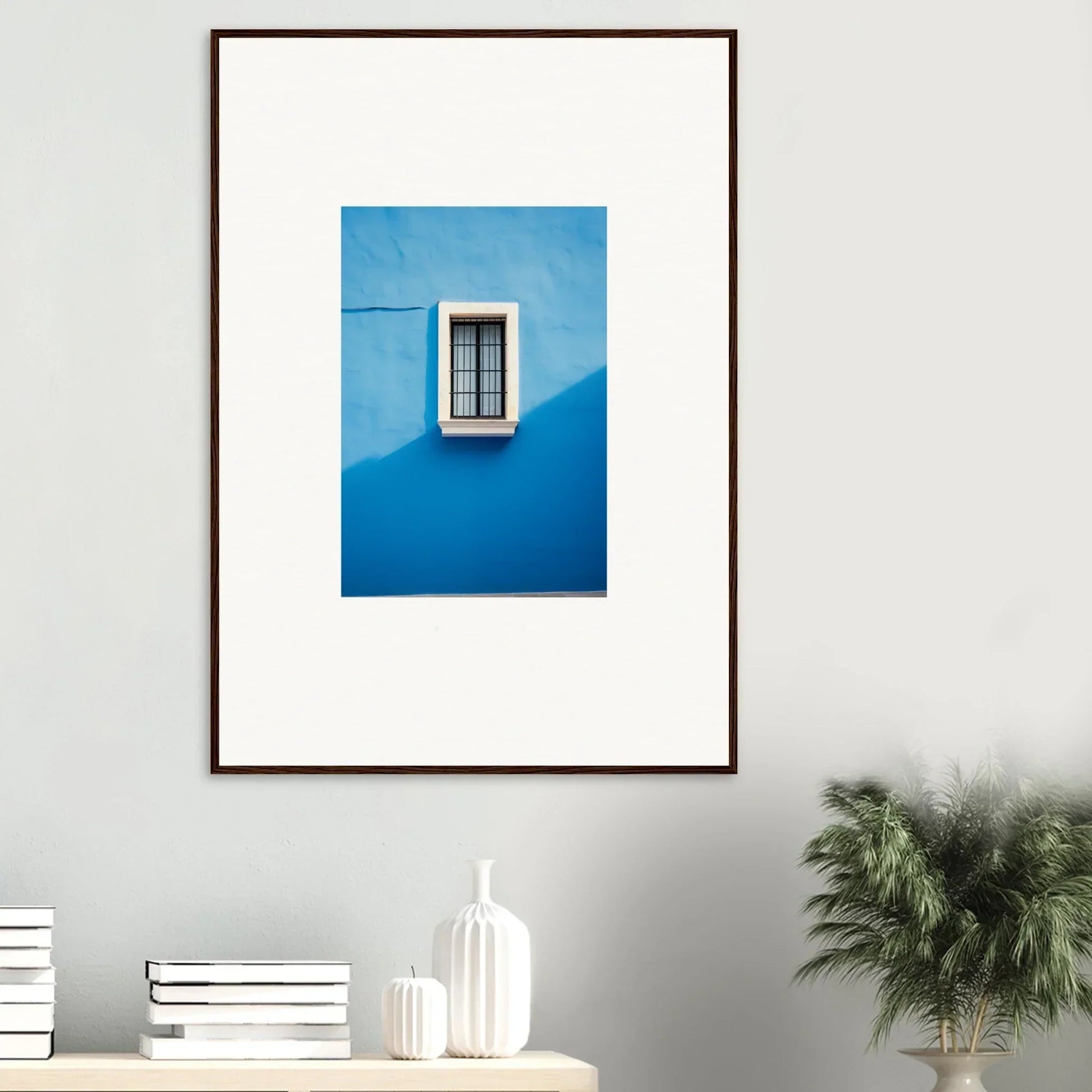 Framed photo of a window on a bright blue wall, part of Reflective Cerulean Daydreams