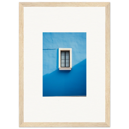 White-framed window with black bars on a blue wall from Reflective Cerulean Daydreams