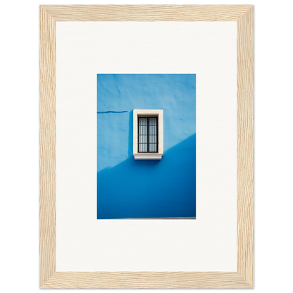 White-framed window with black bars on a blue wall in Reflective Cerulean Daydreams