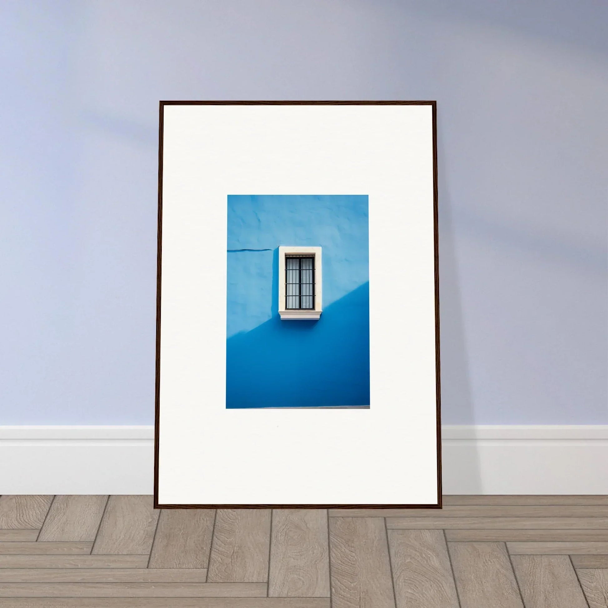 Framed photo of a window on a bright blue wall in Reflective Cerulean Daydreams