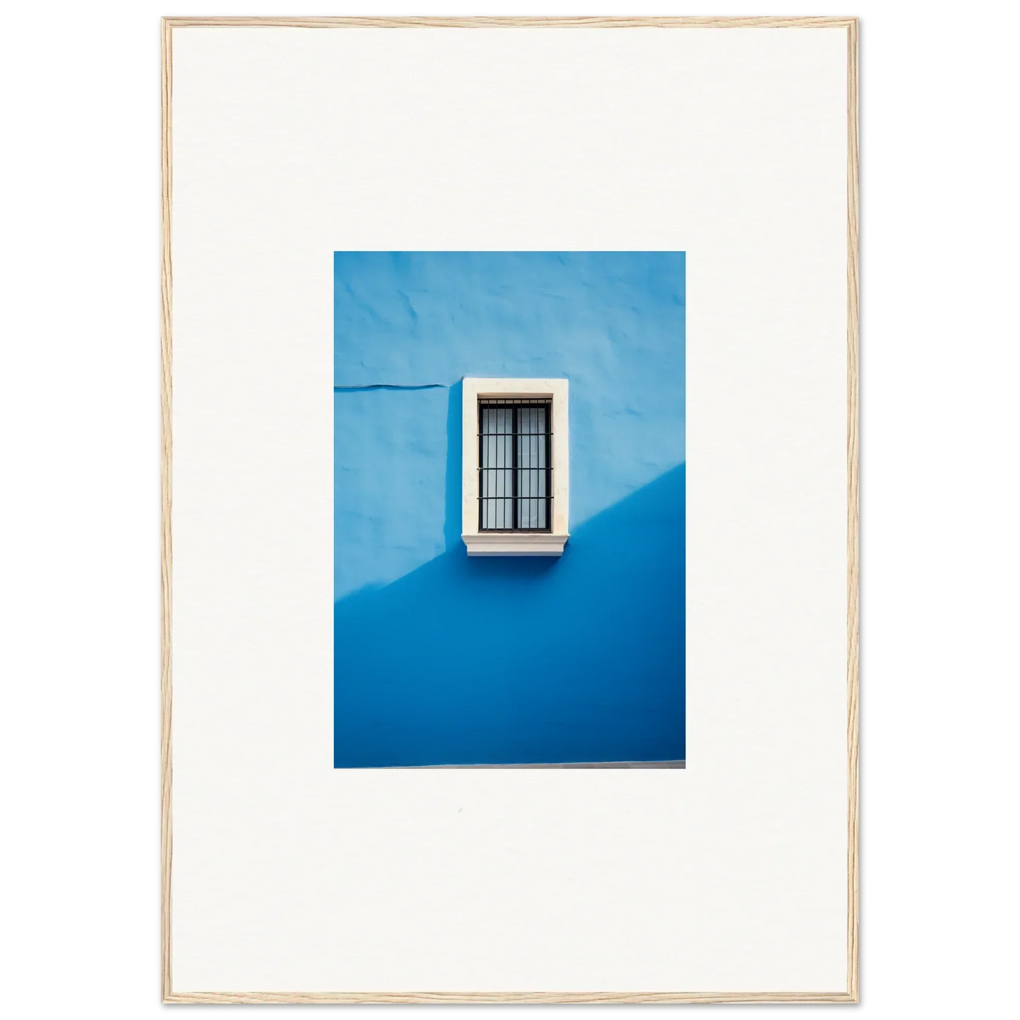 White-framed window with bars against a bright blue wall in Reflective Cerulean Daydreams