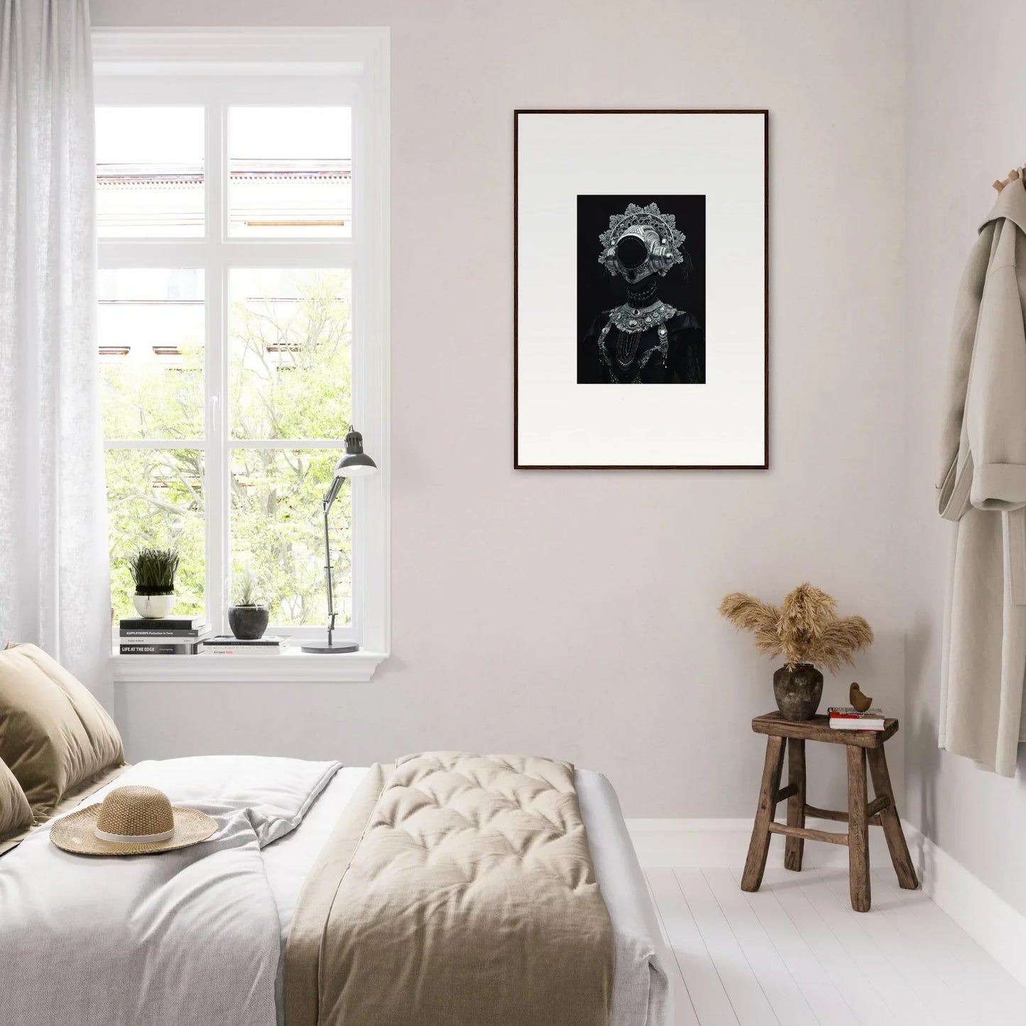 Cozy bedroom with neutral tones, minimalist decor, and stylish framed wall art