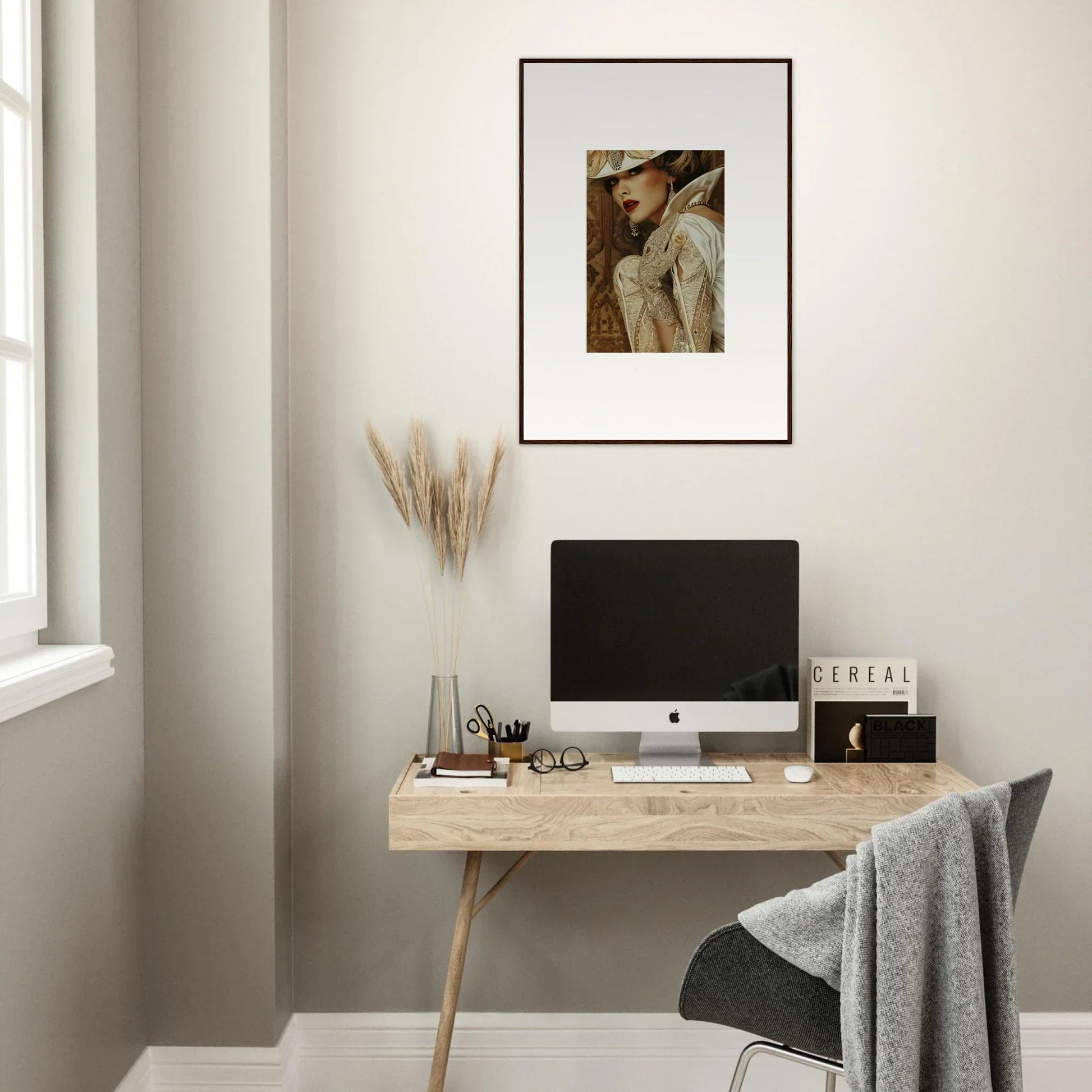 Minimalist home office with wooden desk, computer, and Reverie Seduction canvas print