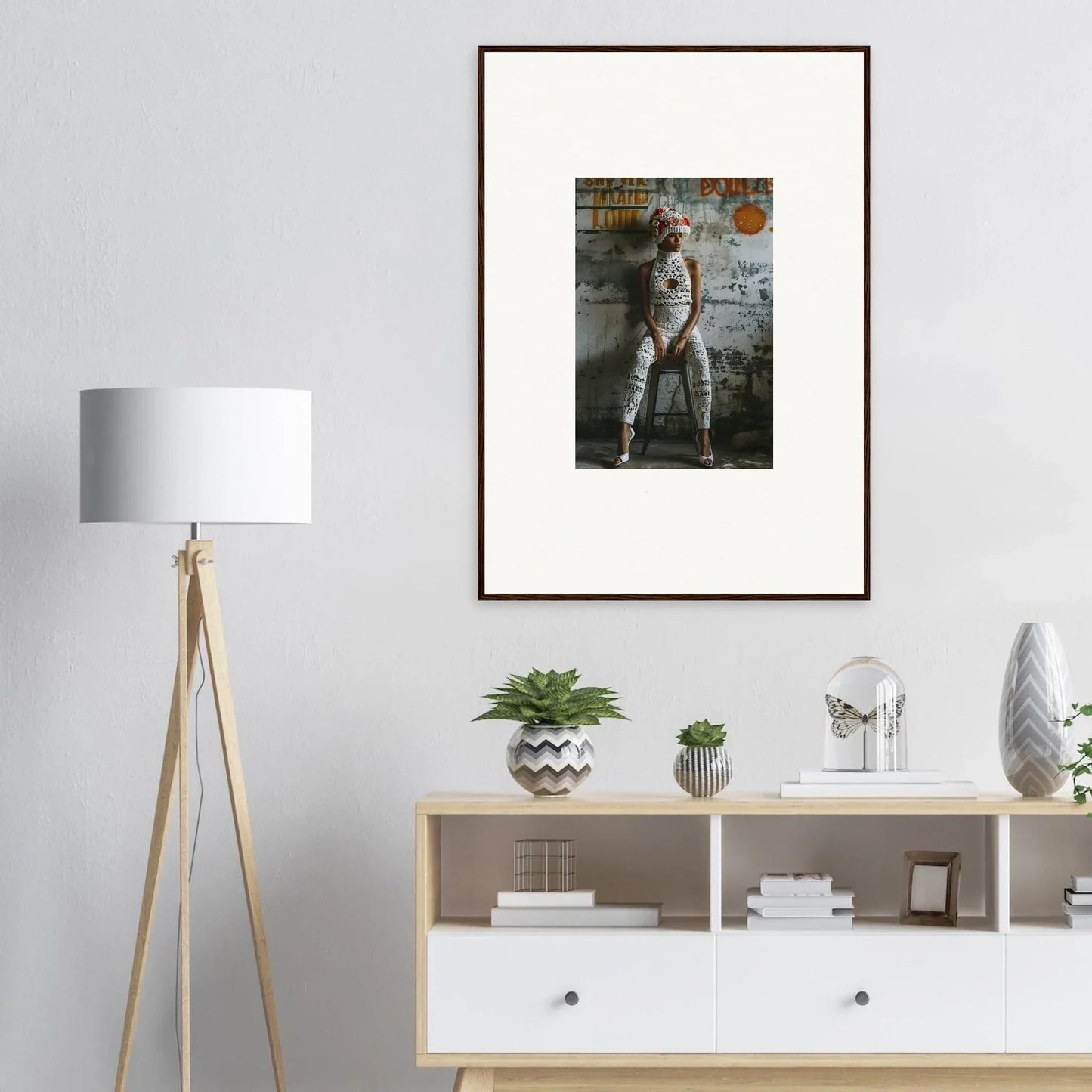 Framed wall art featuring a person by a weathered wall, enhancing room decor with Geometry Whisper