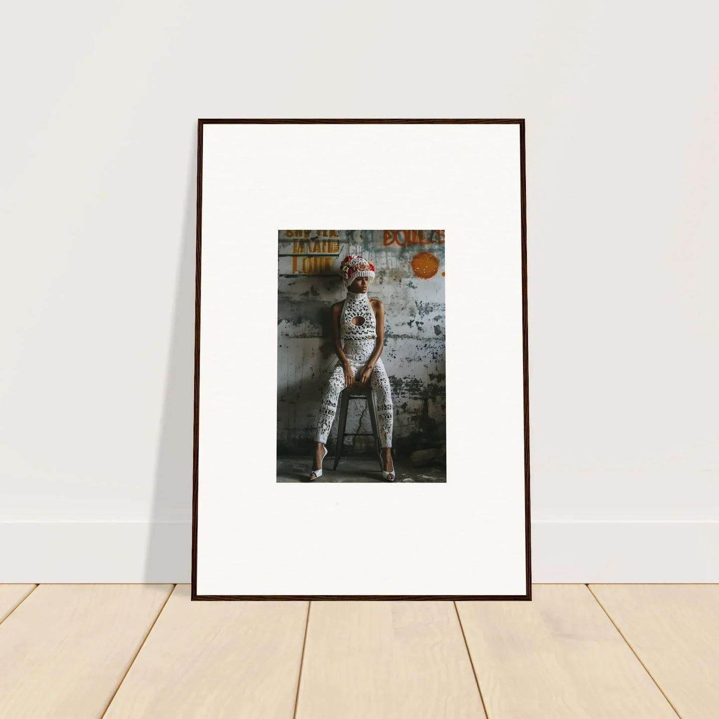 Framed wall art of person in astronaut suit against graffitied wall, Geometry Whisper decor