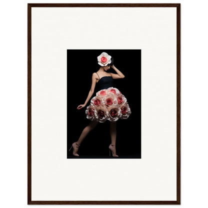 Elegant figure wearing a dress made of pink roses against a dark background.