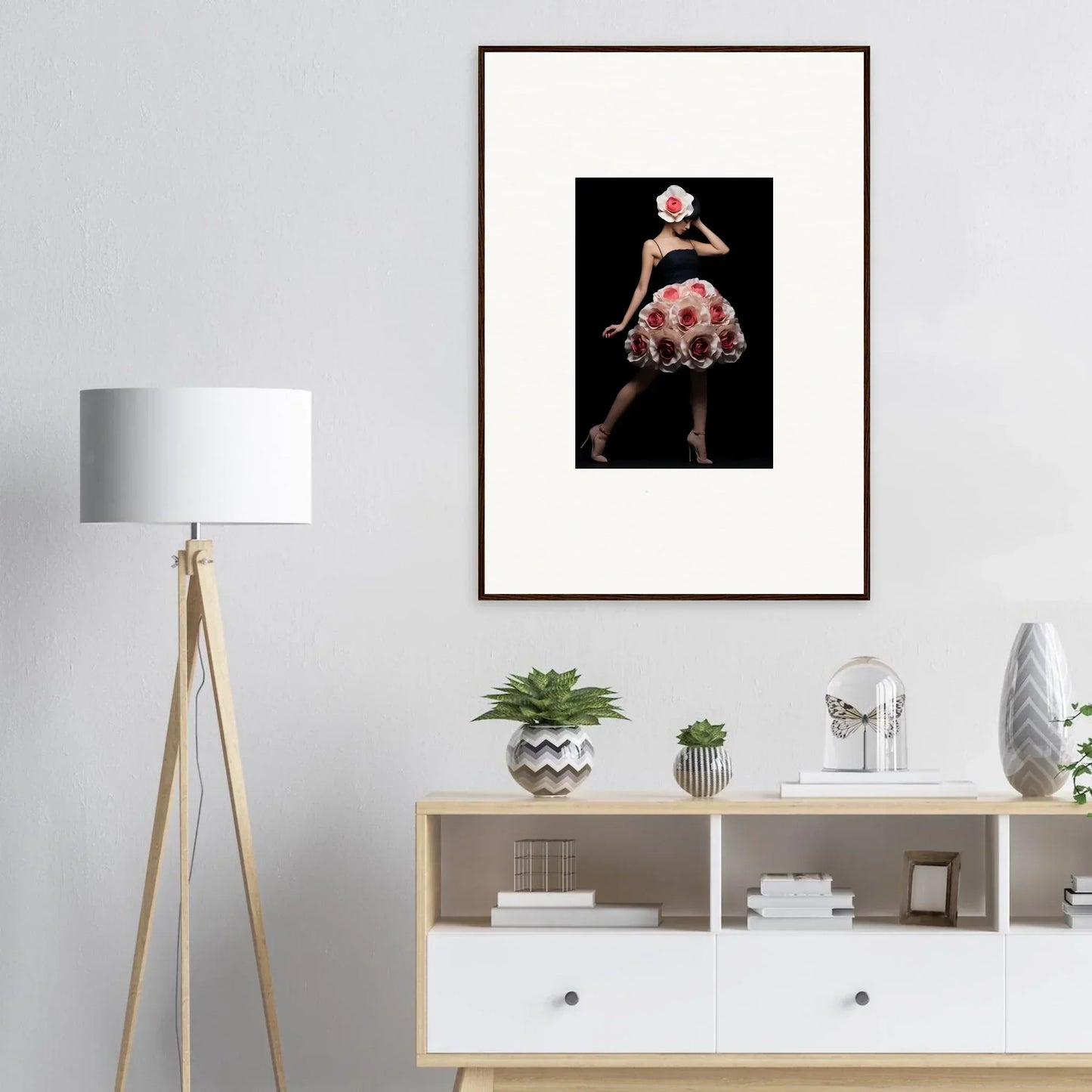 Framed photograph of a dancer in a polka dot dress against a dark background.