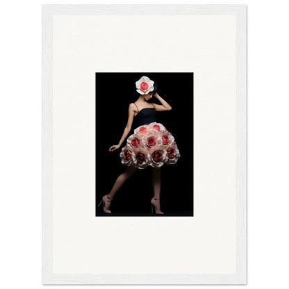 A figure wearing a dress and hat made of red and white roses against a dark background.