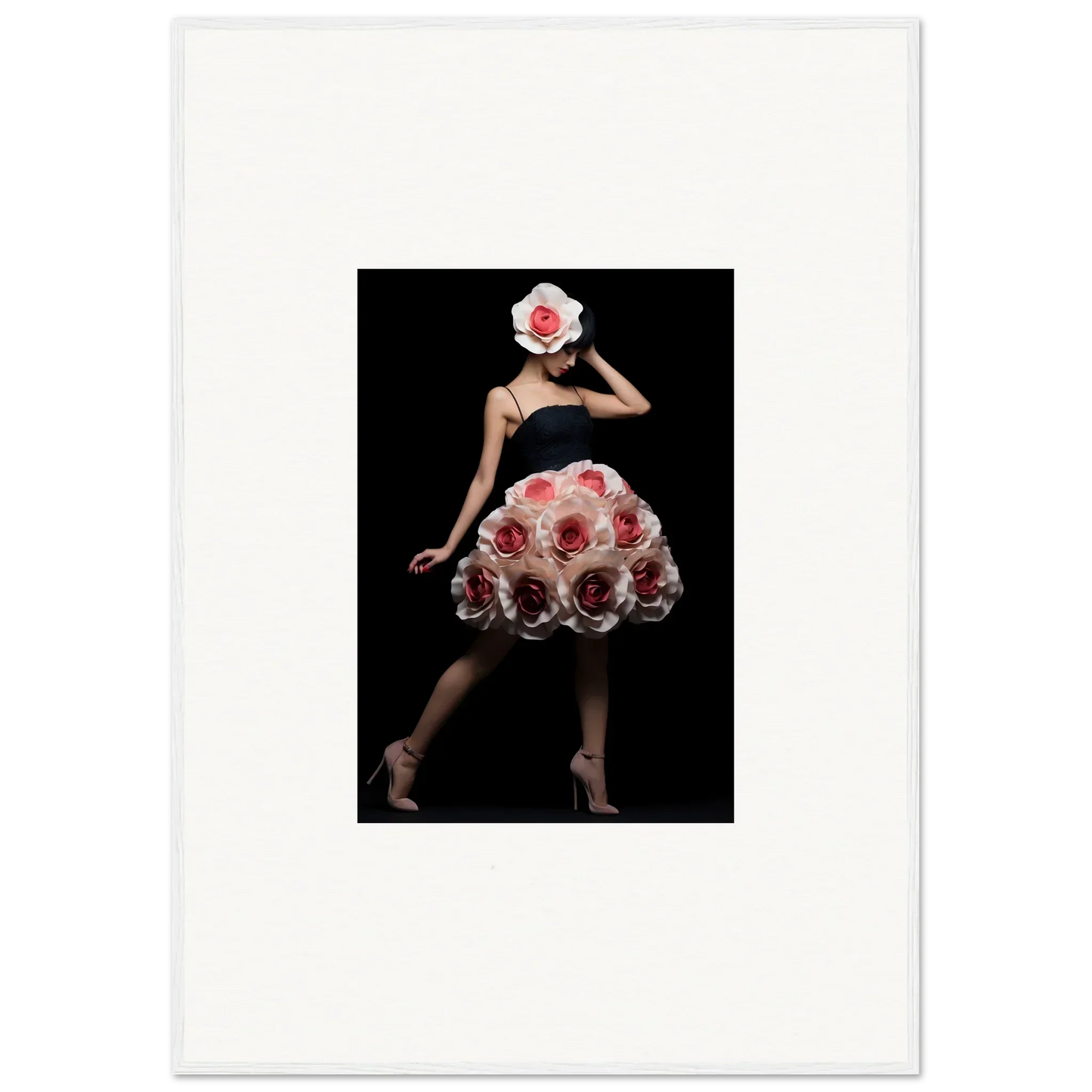 Elegant figure wearing a dress and hat adorned with vibrant red roses.