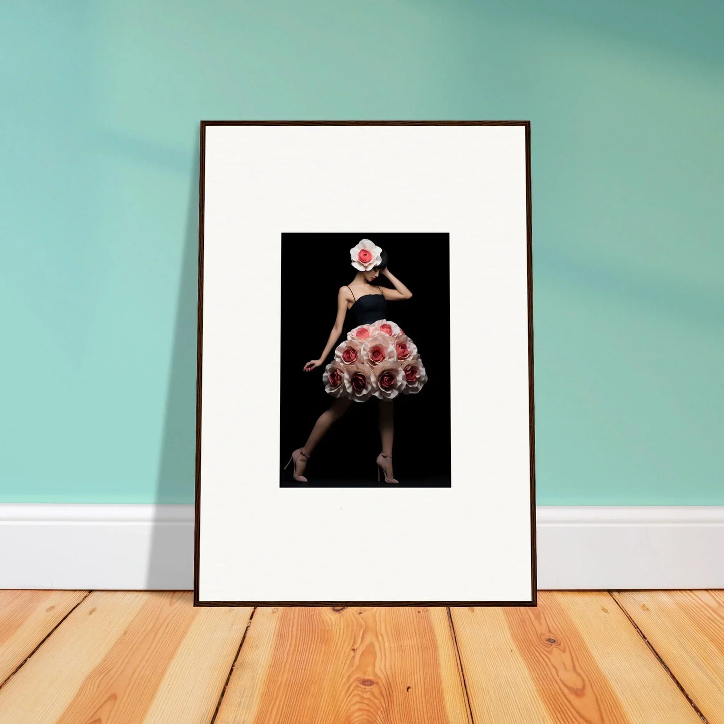 Framed artwork depicting a figure in a polka dot dress against a dark background.