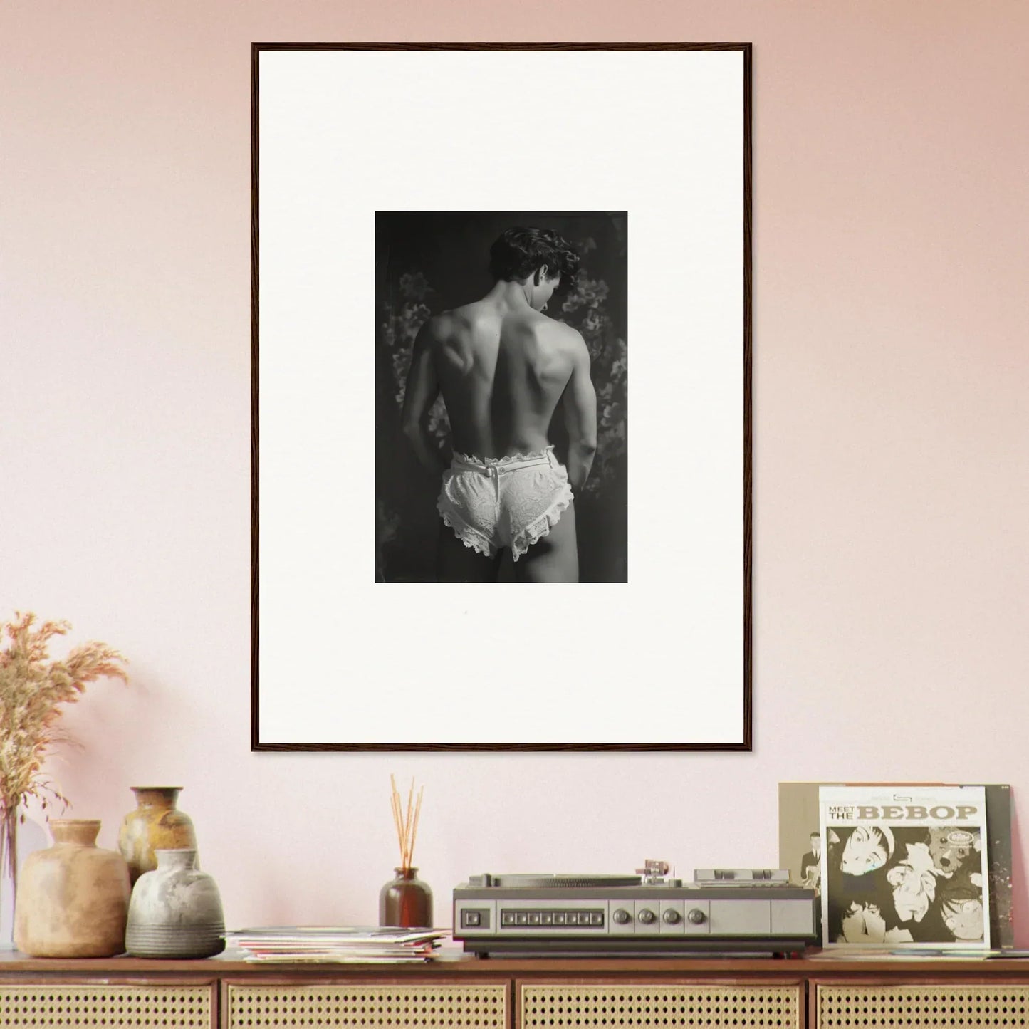 Framed black and white canvas print of a person’s bare back in white shorts for chic room decoration