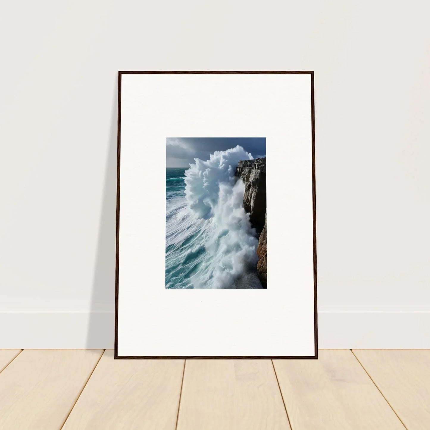 Framed wall art of aqua resonances with a wave crashing against a rocky cliff