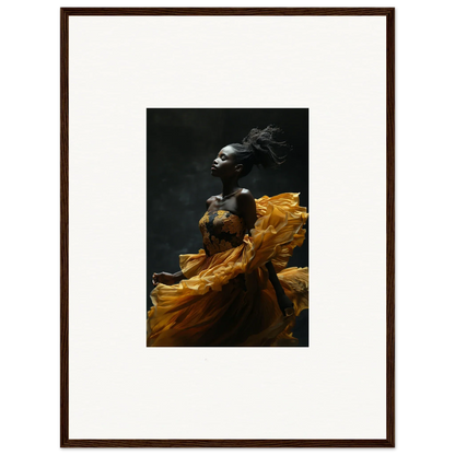 Dramatic portrait of a person in motion, wrapped in flowing golden fabric against a dark background.