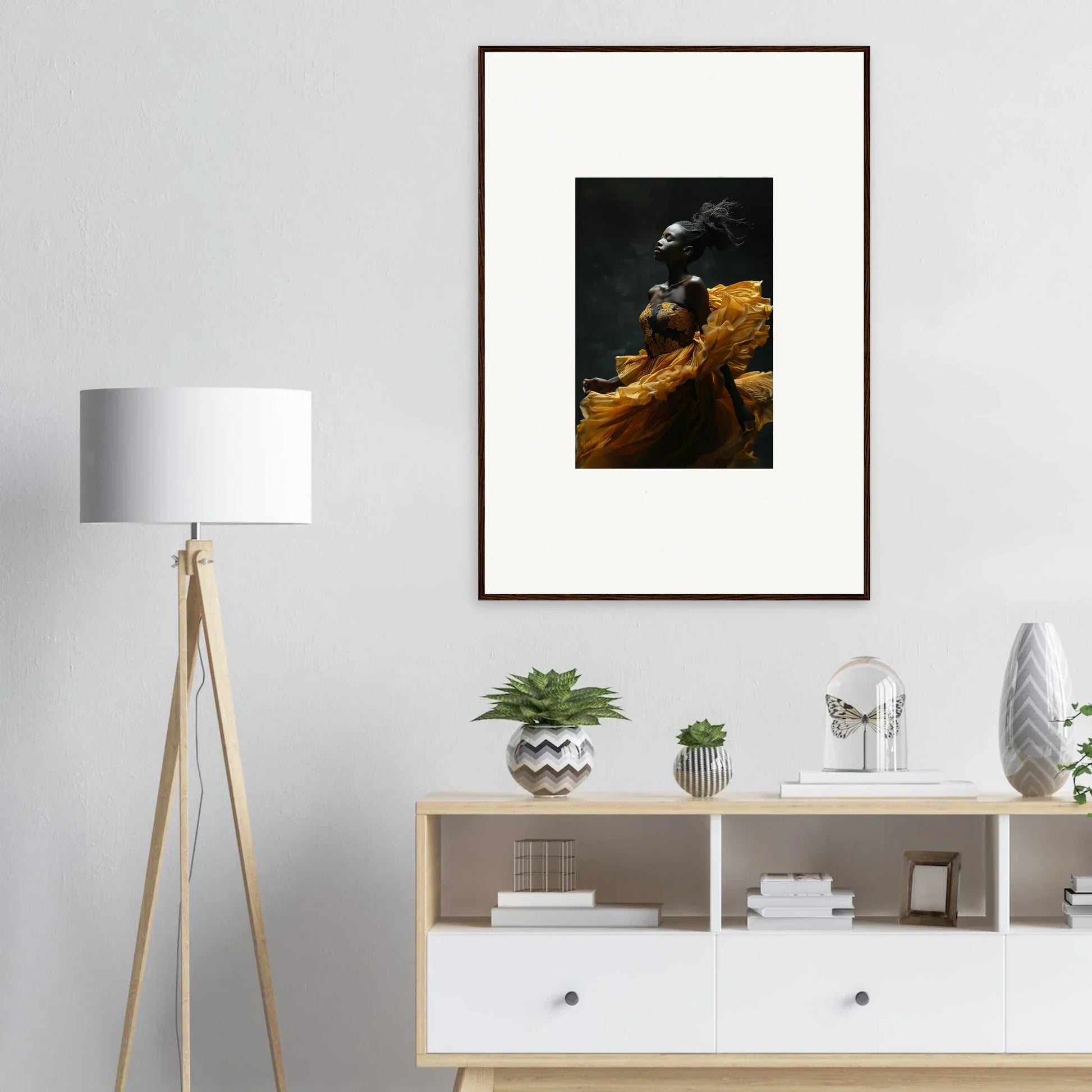 Framed artwork depicting a dark, moody landscape with golden cliffs or mountains.