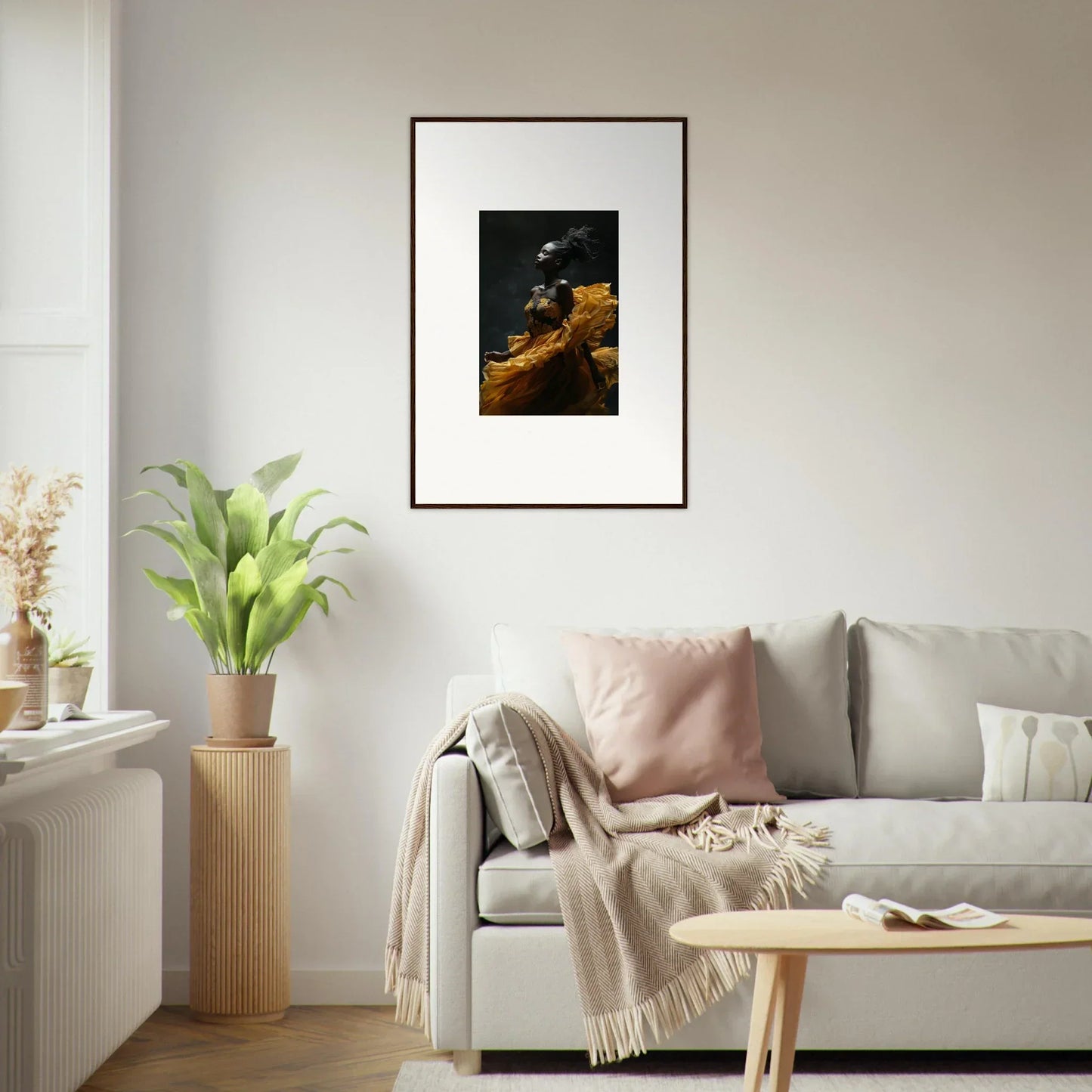 Framed artwork depicting a dark landscape with a golden cliff or rock formation.