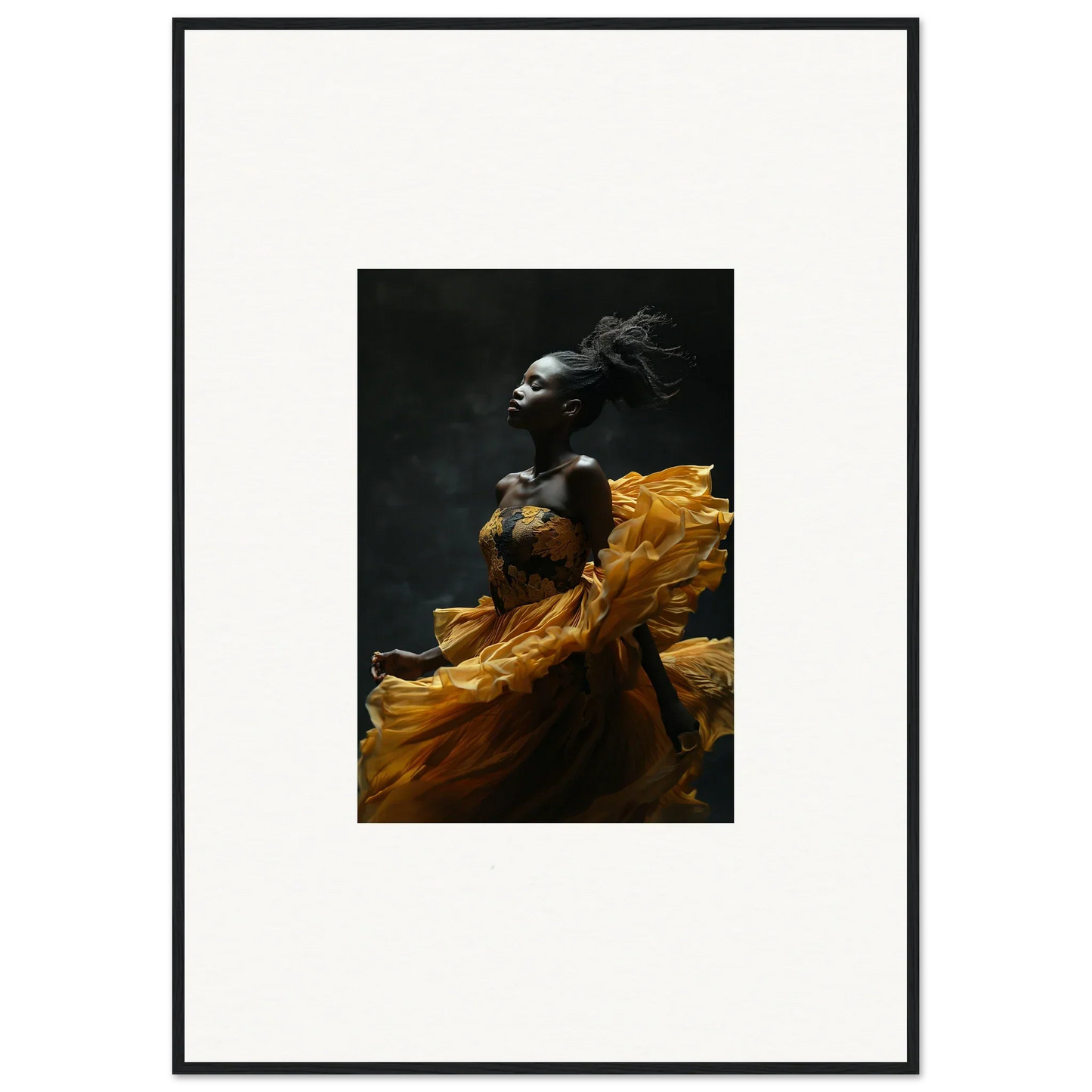 Striking photograph of a person in flowing yellow fabric against a dark background.