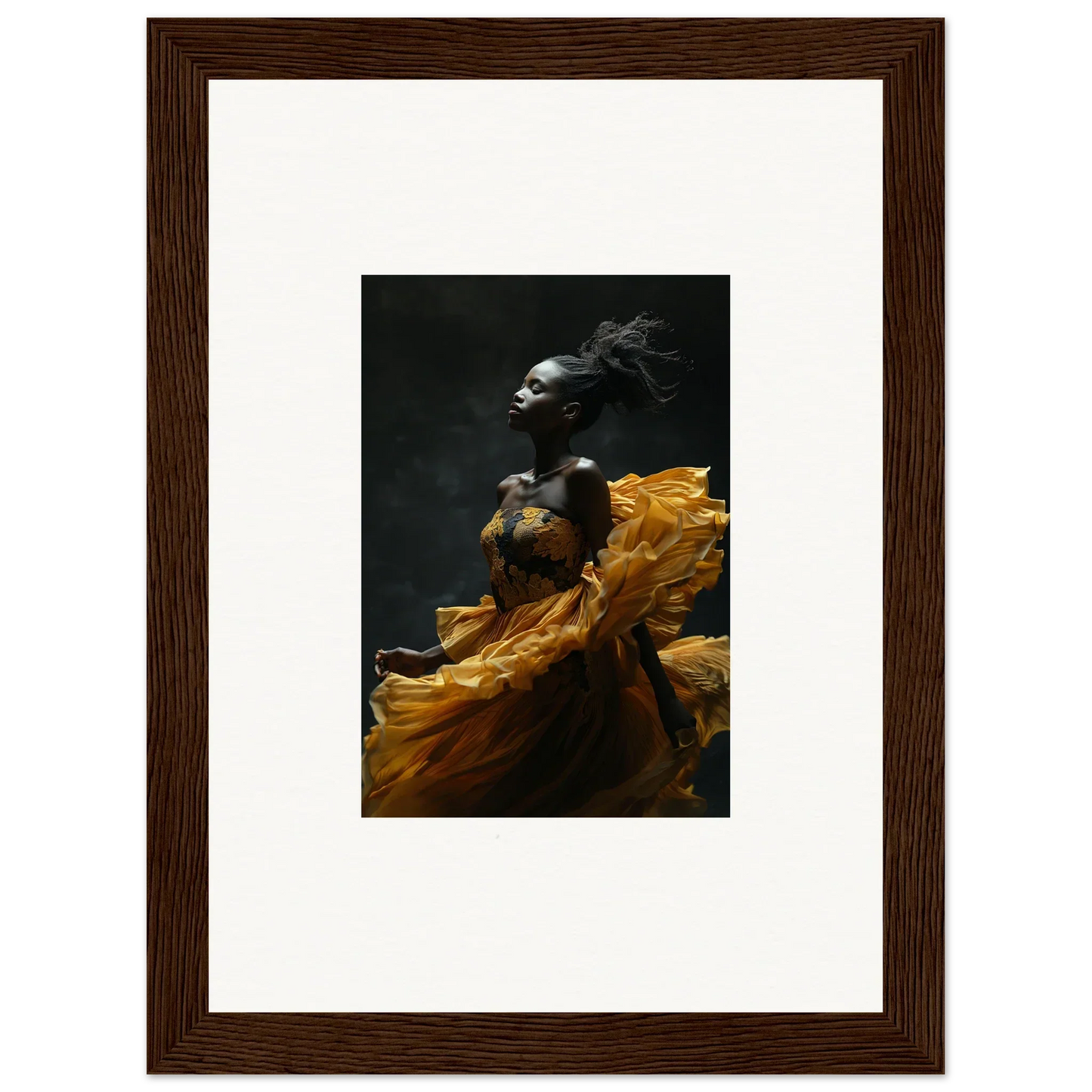 Dramatic photograph of a person wearing flowing yellow fabric against a dark background.