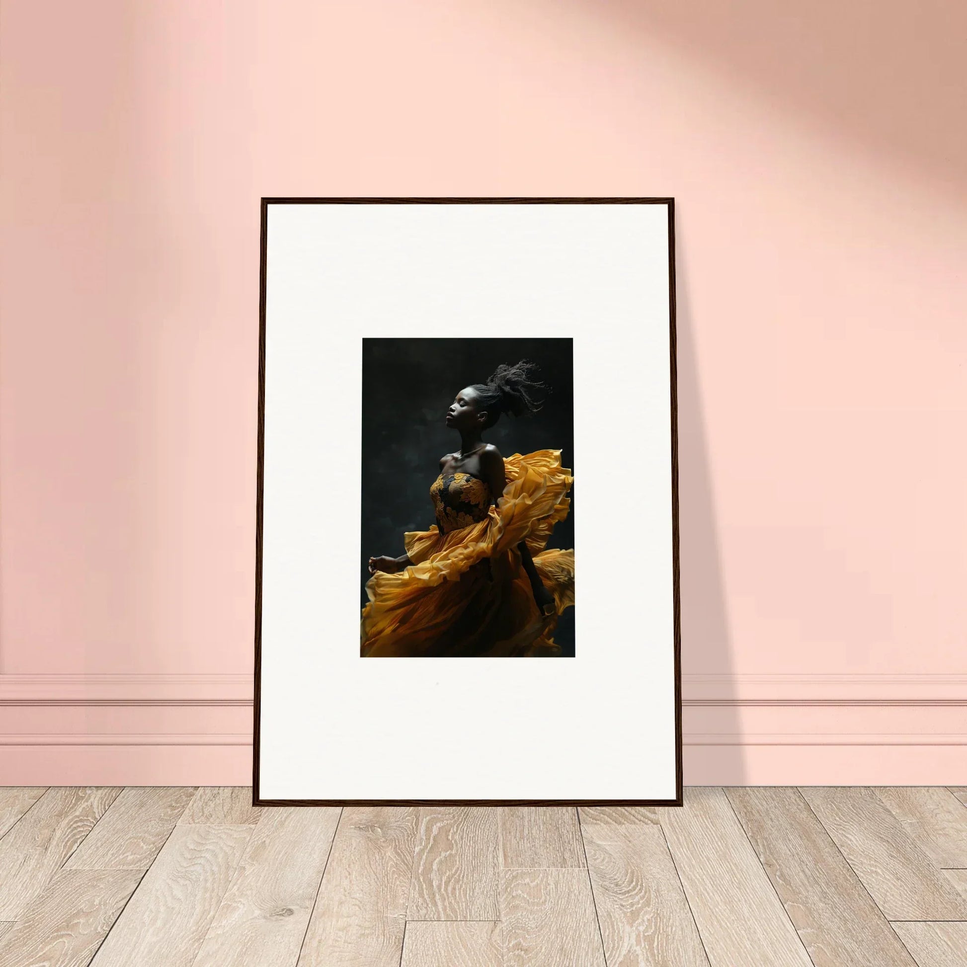 Framed artwork depicting a dark bird perched on a golden-hued surface against a black background.