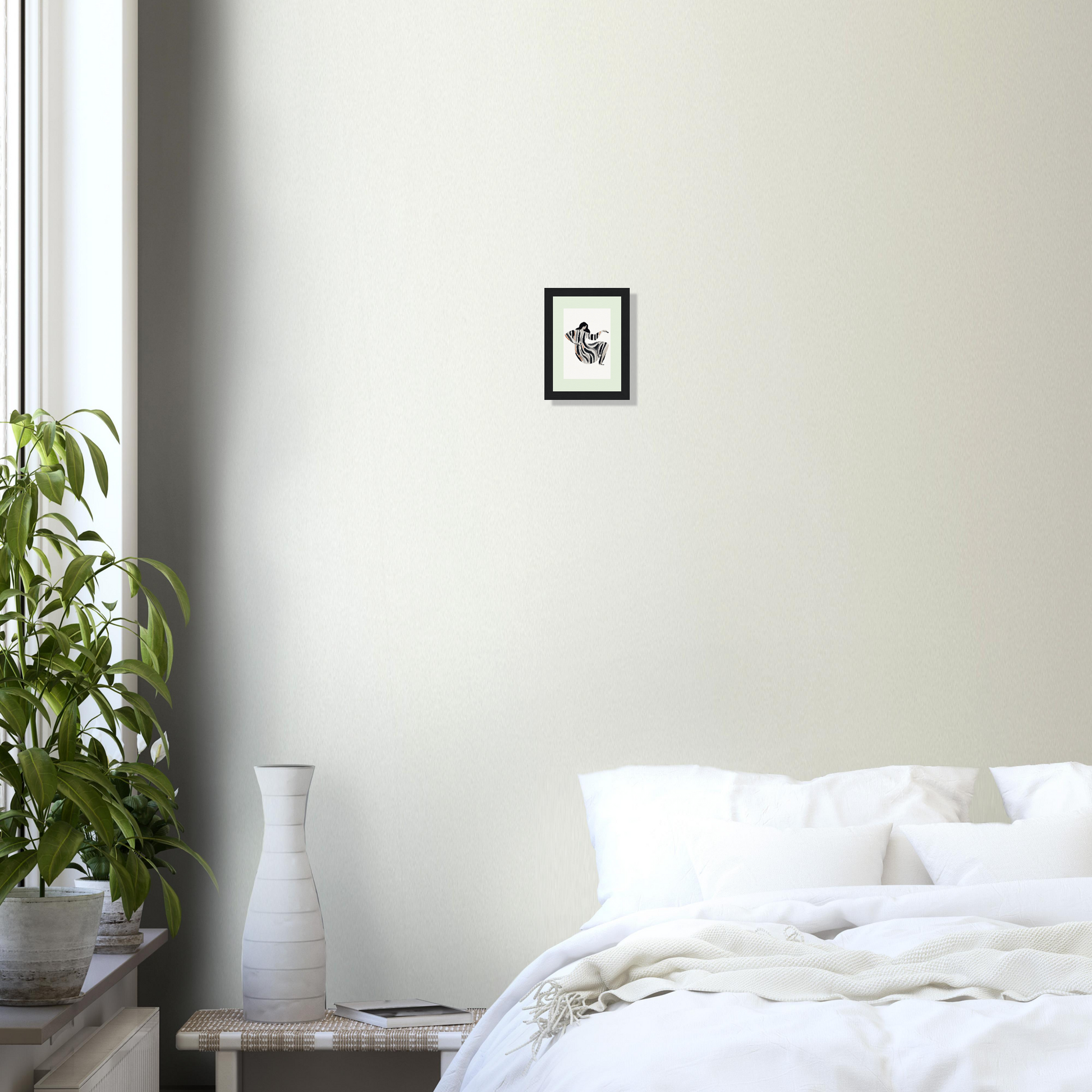 Unmade bed with white bedding and pillows.