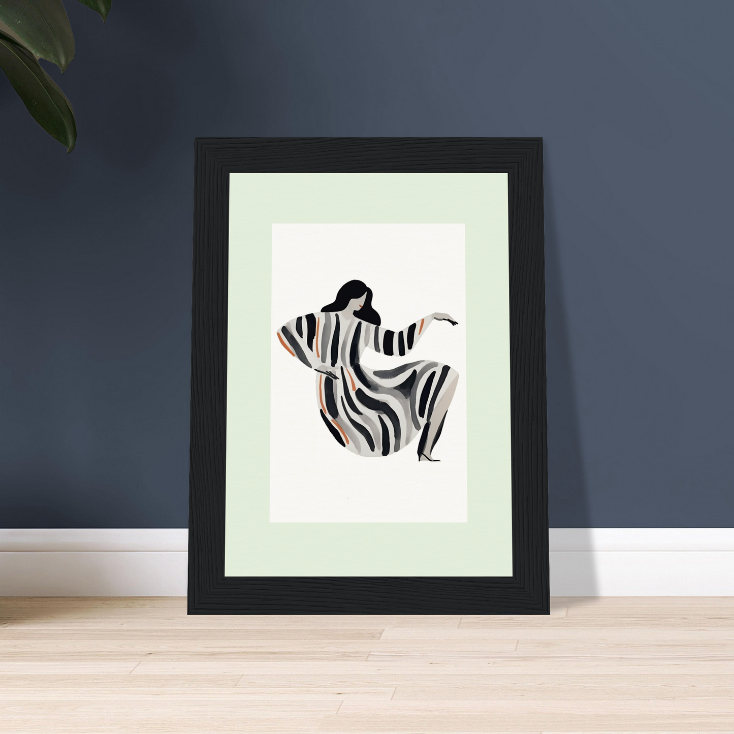 Framed minimalist artwork depicting a stylized figure in a flowing zebra-striped robe.