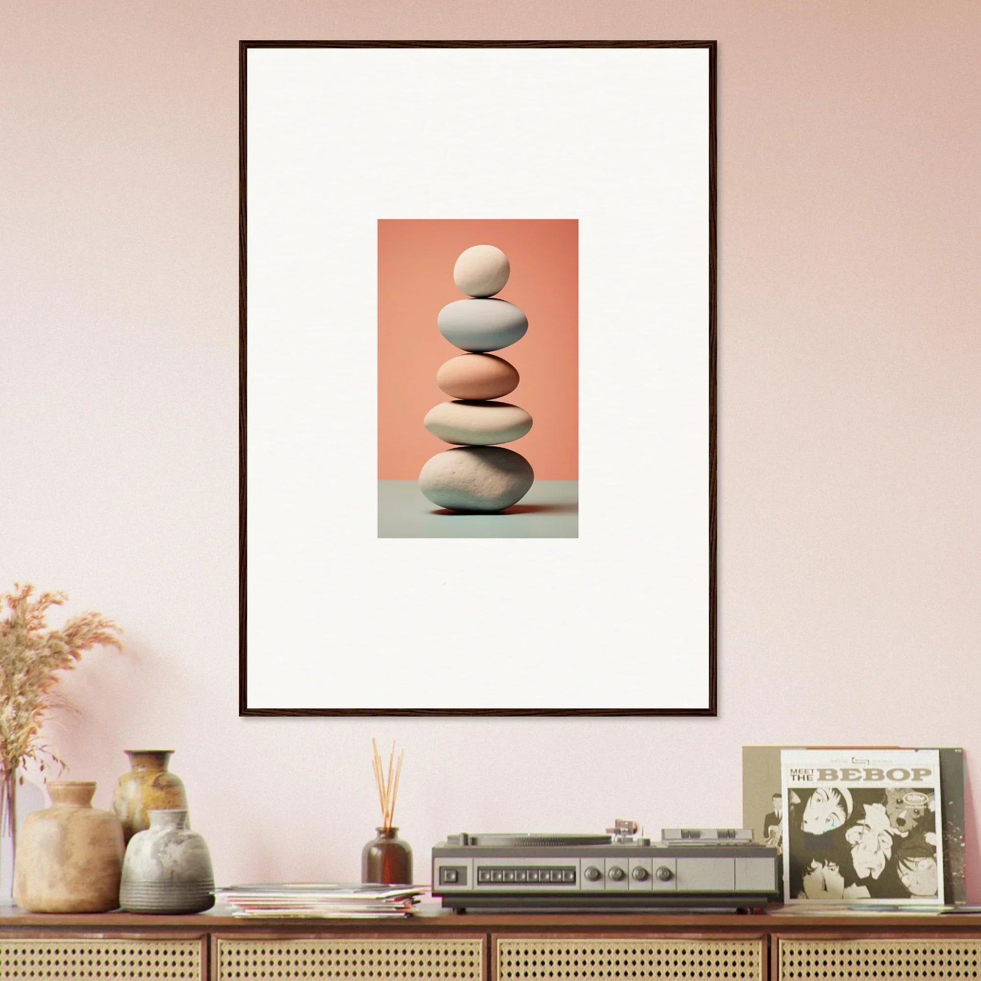 Framed canvas print of balanced stones on peach background for marble sands room decoration