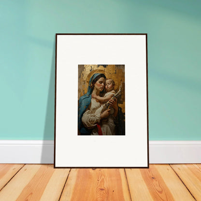 Framed wall art of a woman in blue holding a baby for stylish room decor