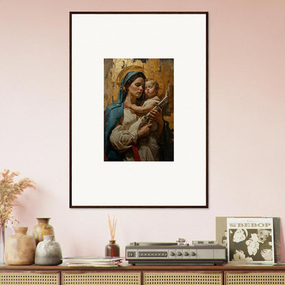 Framed wall art of a woman holding a baby, perfect for room decor