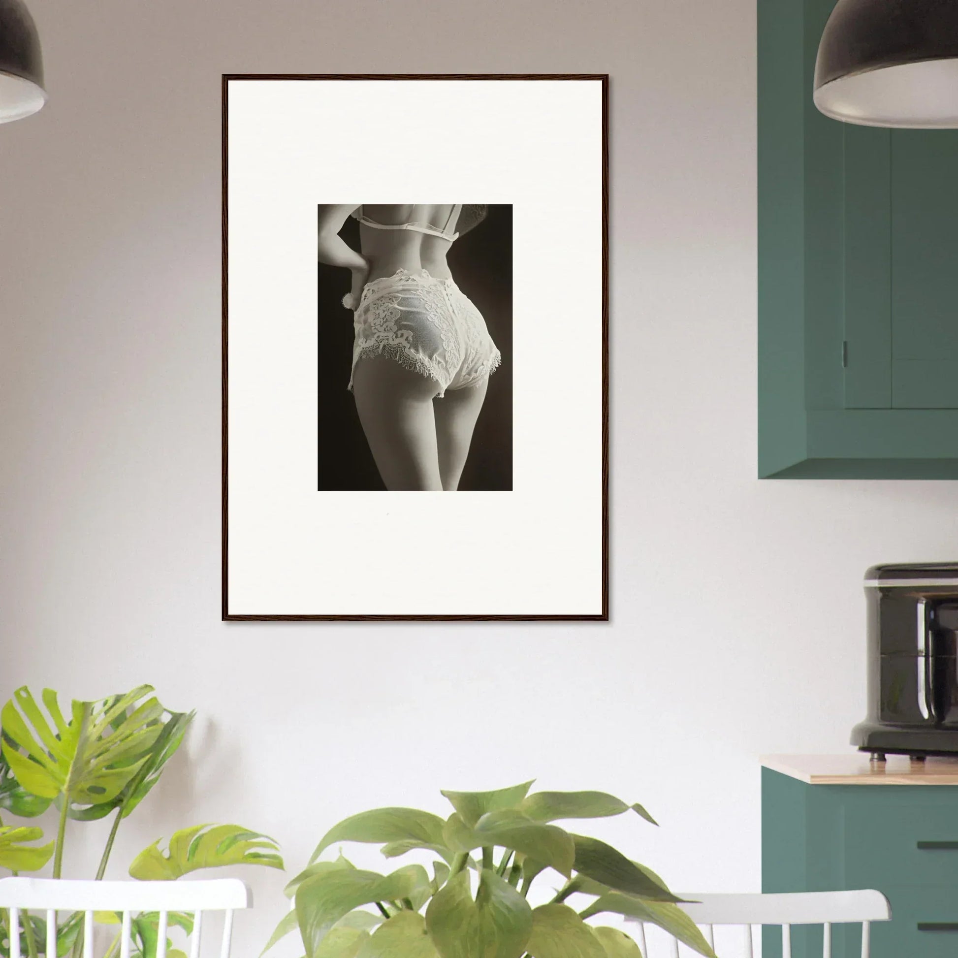 Framed black-and-white canvas print of lace curvature on a woman’s lower back