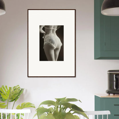 Framed black-and-white canvas print of lace curvature on a woman’s lower back